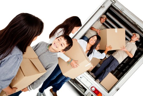 Removal team planning a house move in an Islington street