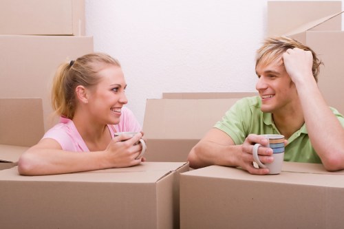 Local moving team handling furniture on an Islington street
