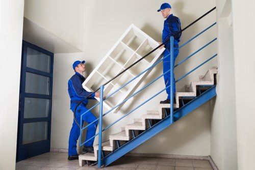 Business moving team handling office furniture and equipment in Islington