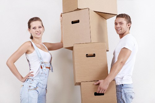 Packed moving boxes and furniture ready for house removals
